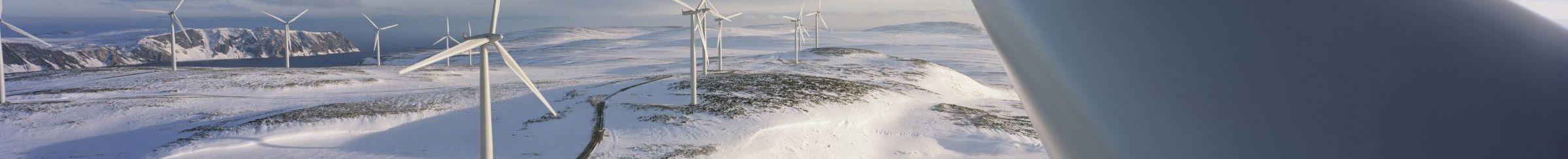 Wind turbine in snow-covered landscape